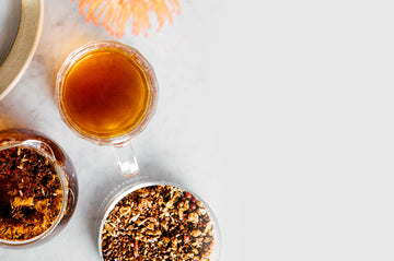  a cup of fall tea surrounded by cups of tea grounds